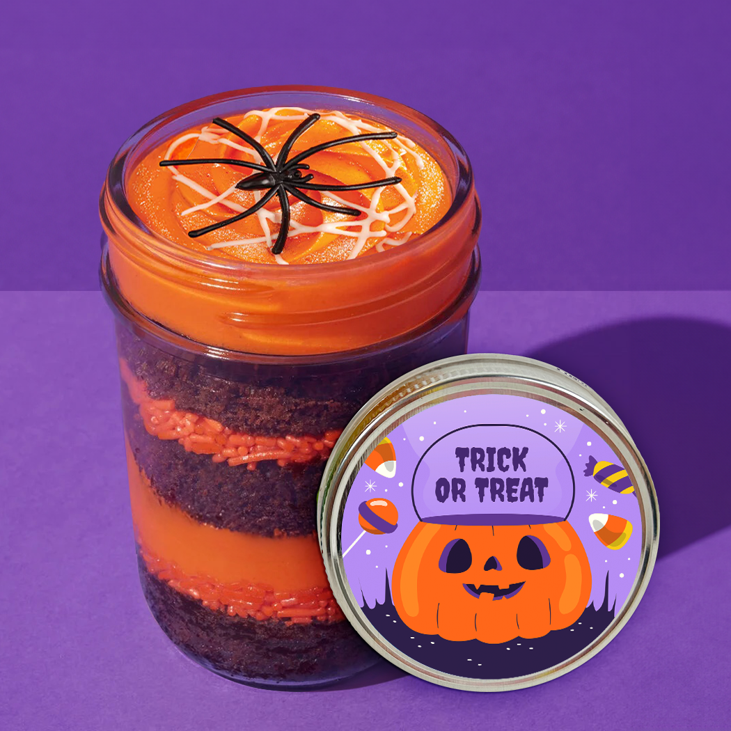 Lid label detail on a Halloween spider kosher cupcake jar with spider toppers and orange sprinkles.
