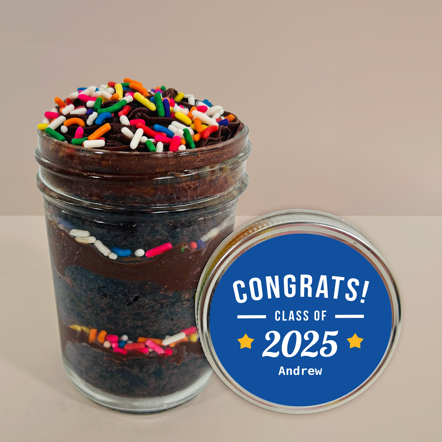 Lid label detail on a chocolate sprinkles kosher cupcake jar.