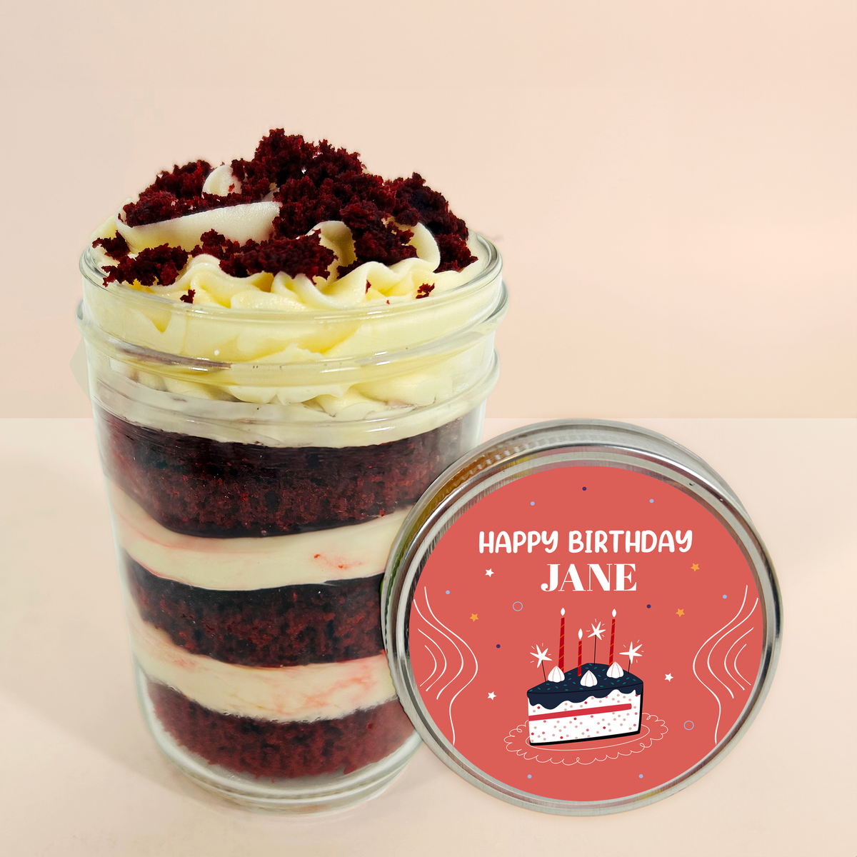 Lid label detail on a red velvet kosher cupcake jar.
