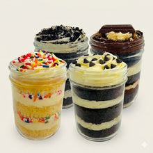 Load image into Gallery viewer, Four layered mason jar cakes (Cupcake Jars) with different flavors showcased against  a white background
