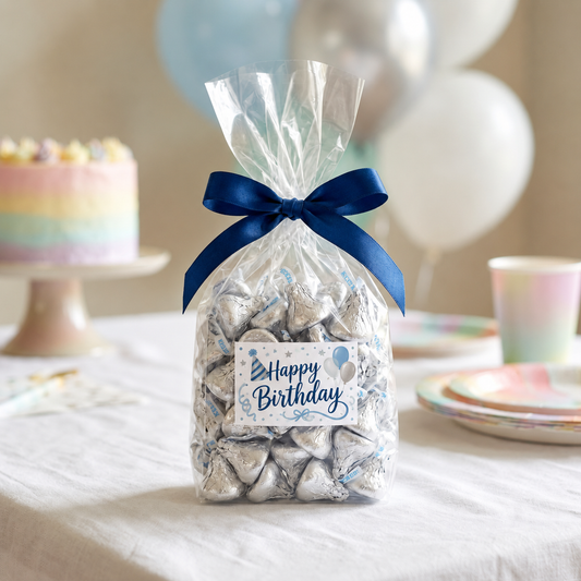 Custom Label Hershey's Kisses candy bag tied with a navy ribbon and a printed Happy Birthday graphic label with a party hat and balloons on a birthday party dessert table, kosher, made in Chestnut Hill MA