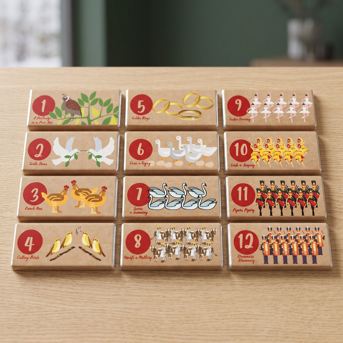 12 Days of Christmas candy bars with twelve numbered illustrated kraft wrappers in a gift box