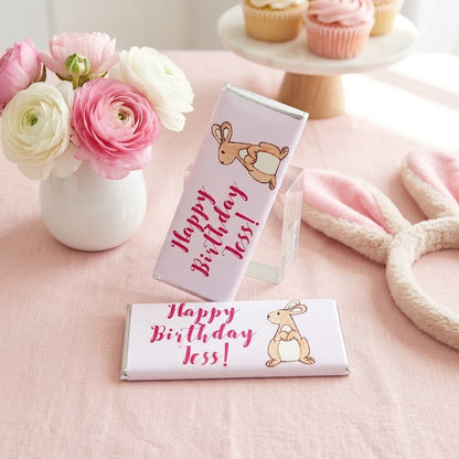 Bunny design, personalized Hershey bars styled with ranunculus flowers and pink cupcakes