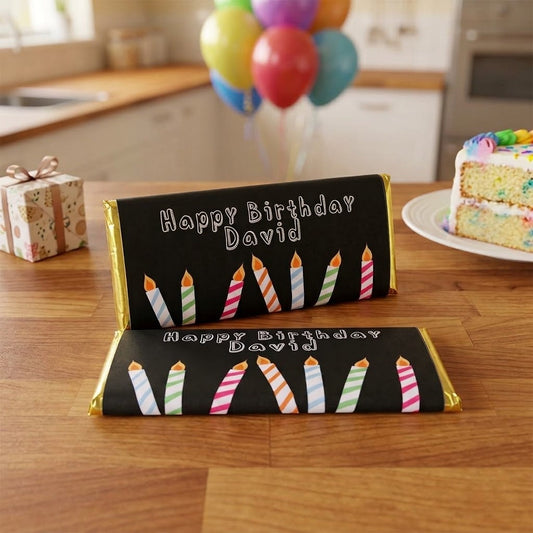 Candles design, personalized Hershey bars in gift box on a kitchen counter with birthday balloons and cake