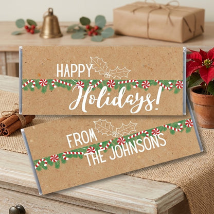 Happy Holidays design, wrapped Hershey bars in kraft paper with peppermint garland, styled on an entryway console with cinnamon sticks and a poinsettia