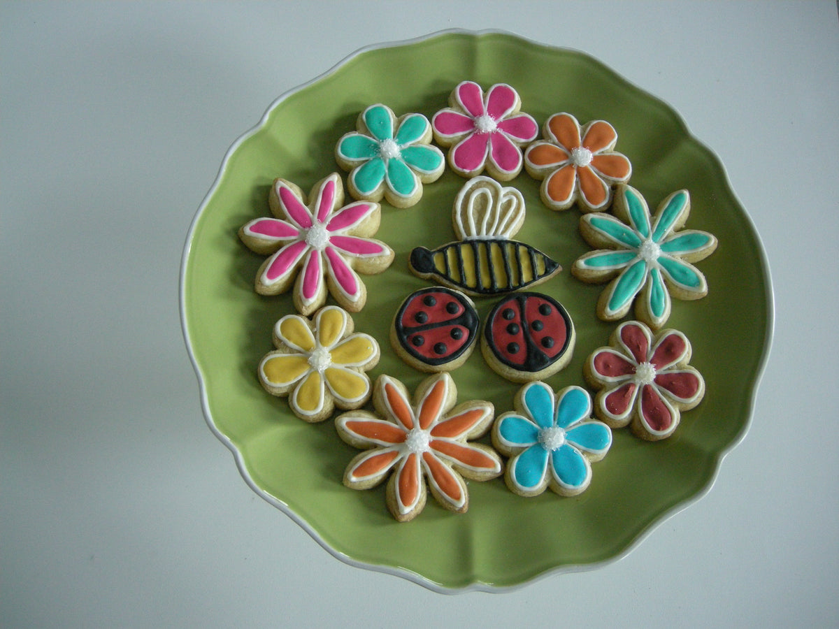 Hand iced kosher spring flower cookies with piped petal detail