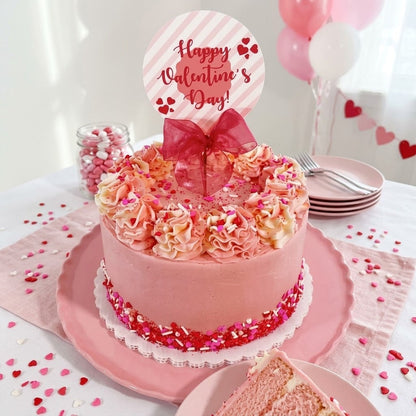 Valentine's Day sprinkles cake with pink and cream buttercream rosettes, a heart sprinkle band and a Happy Valentine's Day topper with a red bow, kosher, made in Chestnut Hill MA