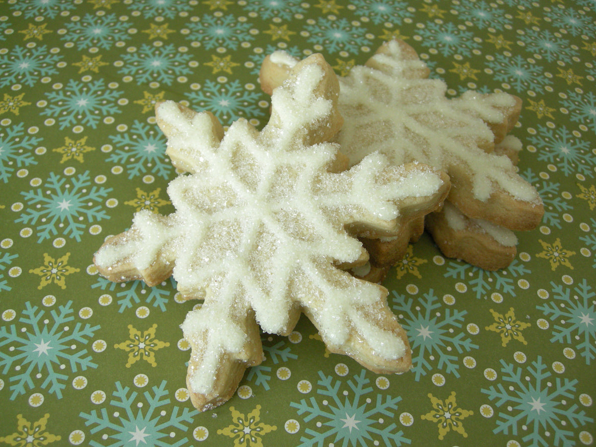 Kosher chocolate snowflake sugar cookies piped in white icing