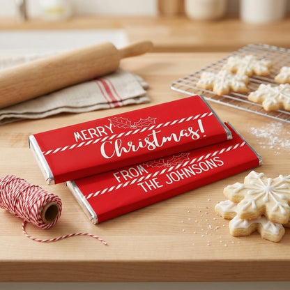 Merry Christmas Candy Cane Stripe design, wrapped Hershey bars, styled on a butcher block with a rolling pin, striped bakers twine and iced snowflake cookies
