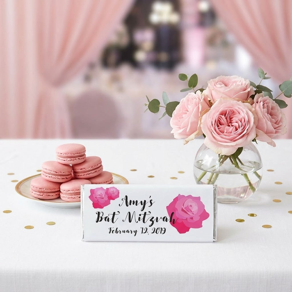 Rose design, personalized rose bat mitzvah wrapped Hershey bar styled on a dessert table with pink macarons and roses