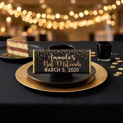 Sparkle design, personalized sparkle bat mitzvah wrapped Hershey bar styled on a black and gold place setting