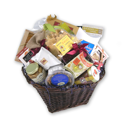 Large thinking of you gift basket with pistachios, dried fruit, tortilla chips and molasses clove cookies in a willow basket