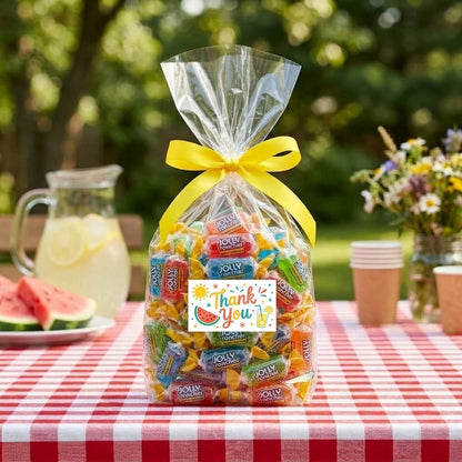 Jolly Rancher candy bag tied with a yellow ribbon and a printed summer Thank You graphic label with a sun and watermelon on a backyard picnic table, kosher, made in Chestnut Hill MA