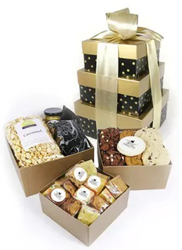 Large holiday gift tower of stacked gift boxes filled with truffles, shortbread cookies, mixed nuts and gourmet popcorn, filling option three
